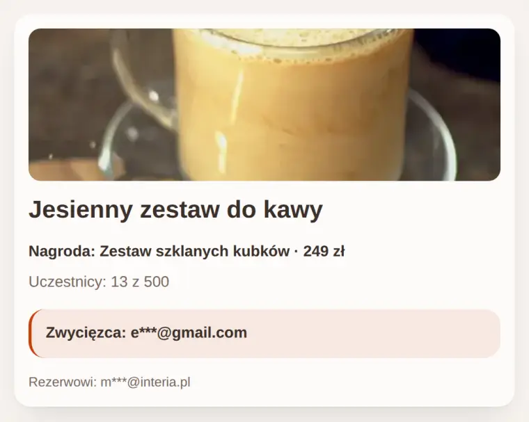 Strona wyników konkursu z kartą nagrody i zamaskowanym zwycięzcą.